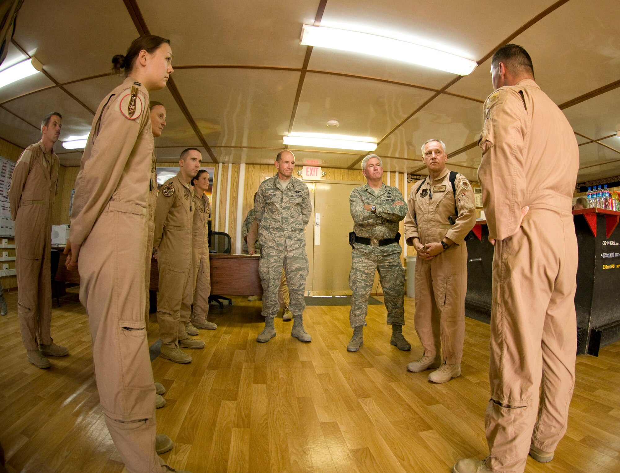 BAGRAM AIR FIELD, Afghanistan -- General Bruce Carlson, Air Force Materiel Command commander, talks to pilots and weapons system officers of the 494th Expeditionary Fighter Squadron here on August 22, 2008. General Carlson later received a briefing on the role the 494th EFS plays in the close air support mission at Bagram Air Field. (U.S. Air Force photo by Staff Sgt. Samuel Morse/Released)