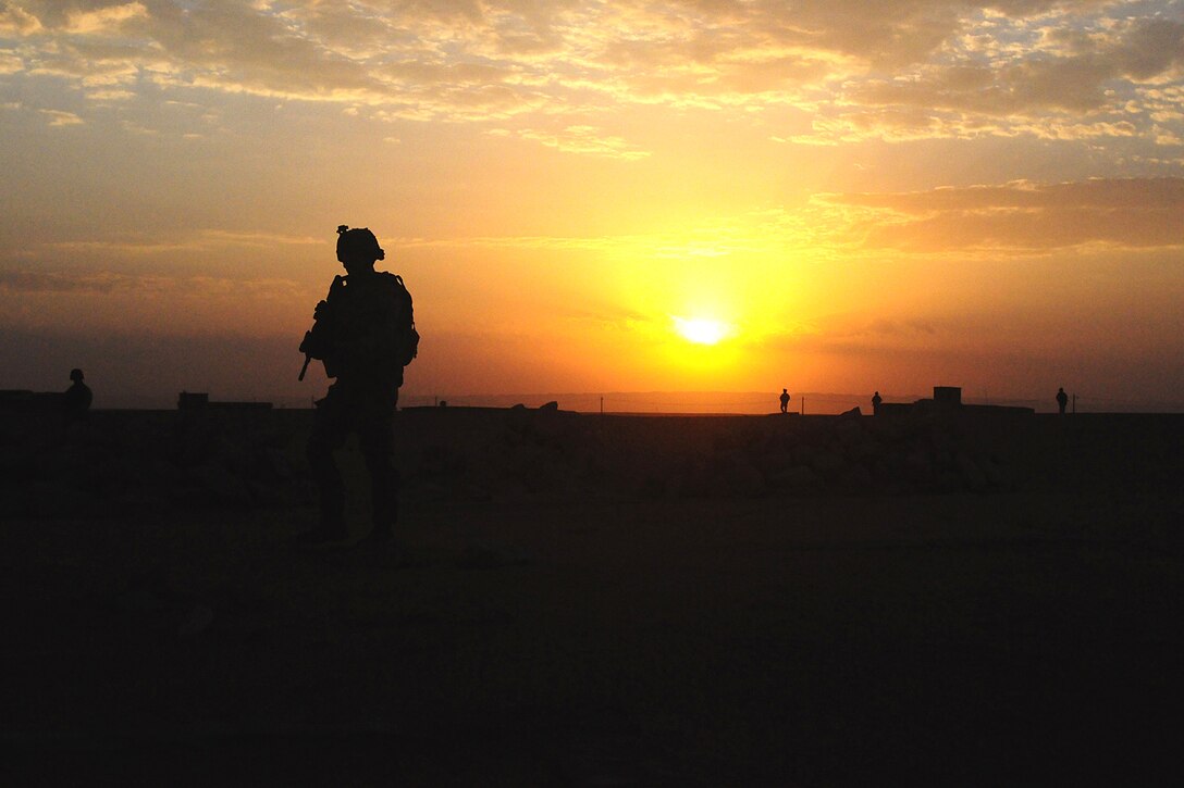 A U.S. Army soldier patrols in the pre-dawn hours during an air assault mission, Operation Bessemer, near Bayji, Iraq, Aug. 21, 2008. 