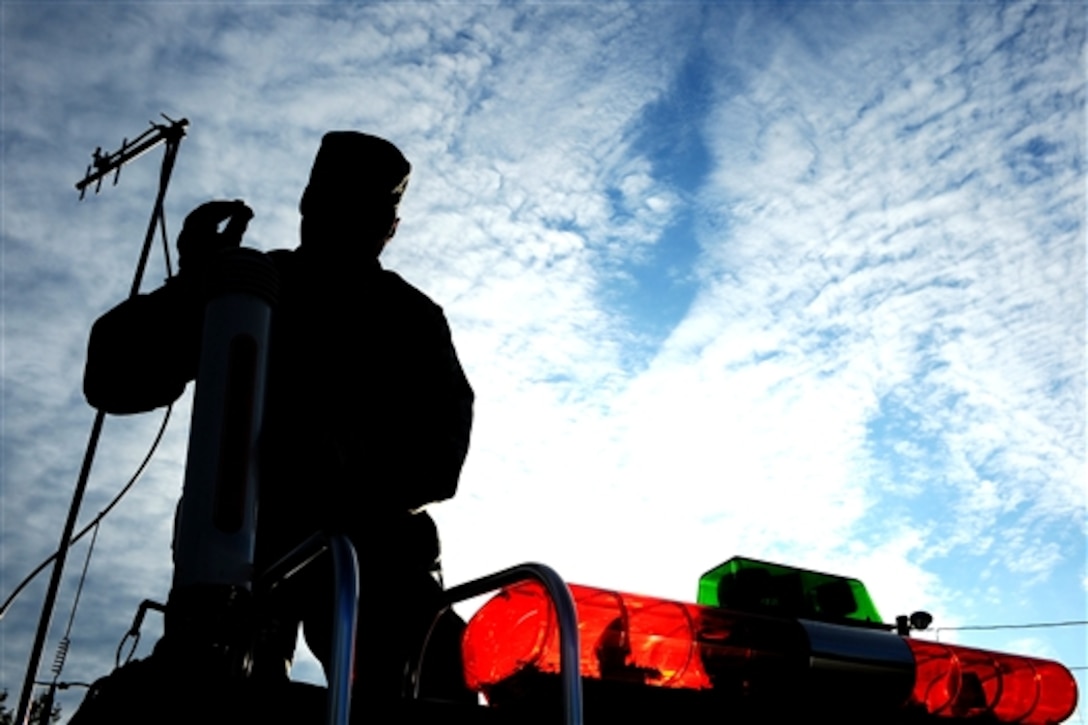 U.S. Air Force Staff Sgt. Michael Huntington installs a Weather Pak antenna on top of a mobile emergency operation center to determine wind speed and direction ensuring that they are a safe distance from any contaminations on Eielson Air Force Base, Alaska, Aug, 28, 2008. Airmen of the 354th Civil Engineer Squadron readiness flight conducted a training exercise to respond to an improvised explosive device with a white, powdered substance attached to it. 