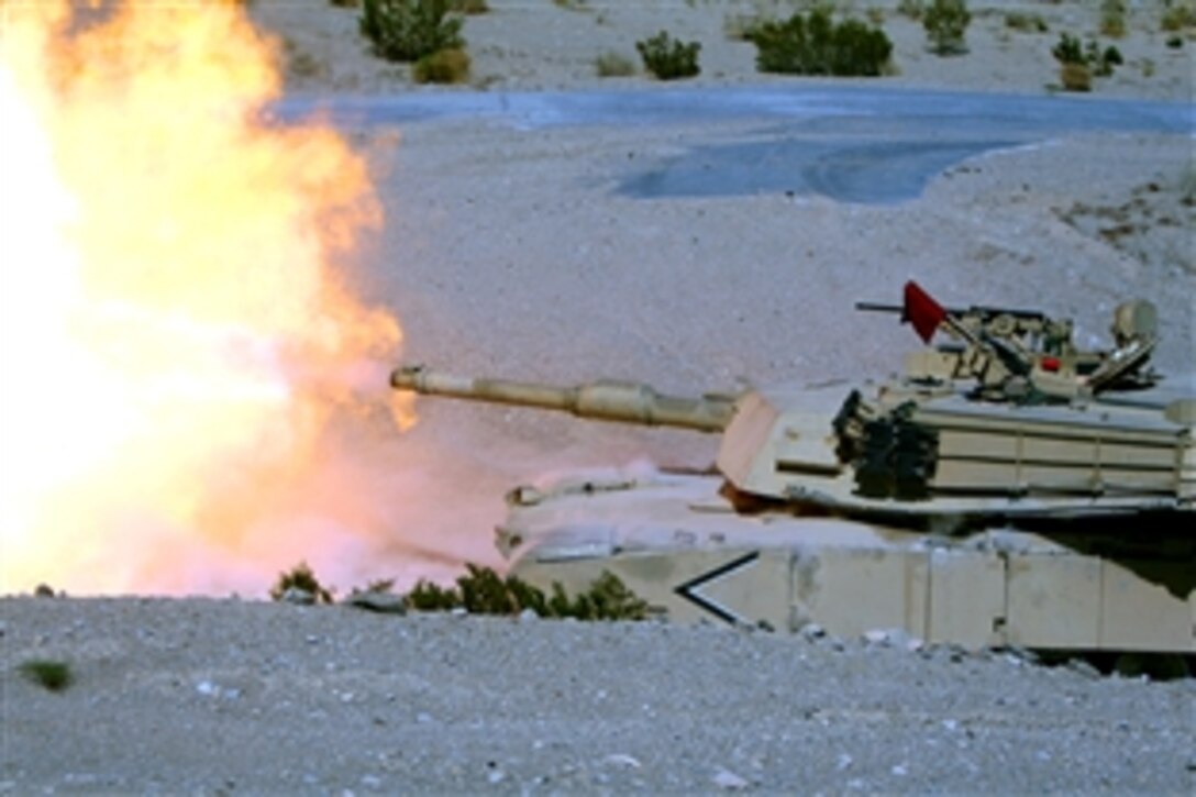 U.S. Marines aboard an M1A1 Main Battle Tank engages light armored targets with explosive anti-tank rounds during the battalion’s bi-annual gunnery qualification at Twentynine Palms, Calif., Aug. 26, 2008. The Marines and tanks are assigned to the 1st Tank Battalion’s Company C. 