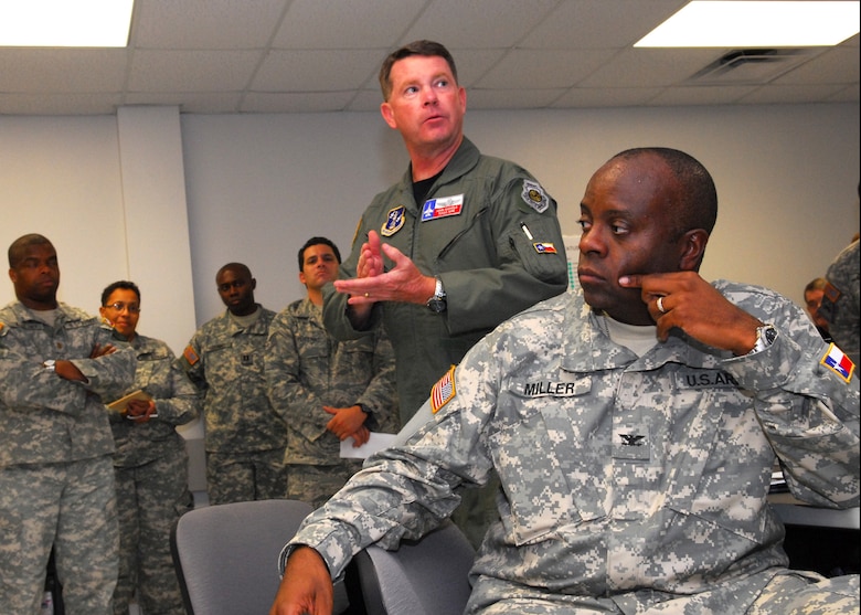 Texas Air National Guard Col John F. Nichols and Texas Army National Guard COL Marvin Miller give guidance and direction during a shift change brief at the Byran Armory.  Nichols, the Joint Task Force Gustav Commander is gearing up Texas Military Forces to take on a variety of missions throughout the state in response to Hurricane Gustav. 