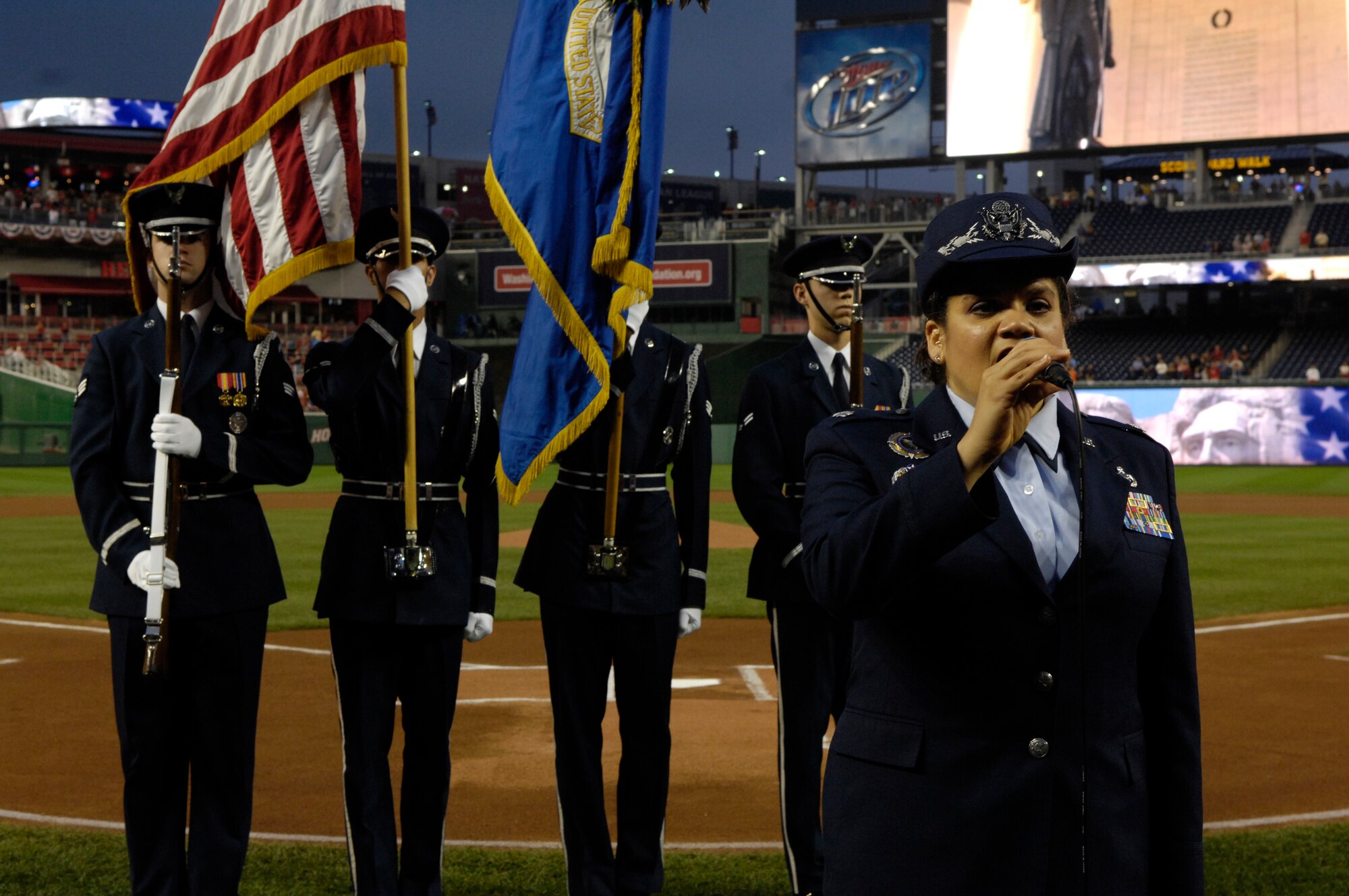 Lieutenant Col. Katherine Strus, director of military personnel for the National Geospatial Intelligence Agency in Bethesda, Md., sings the National Anthem during the Washington Nationals Air Force Appreciation Night held Aug. 29 at Nationals Park in Washington, D.C. This was the first time the Washington Nationals Major League Baseball team held an event honoring the Air Force at the new park. (U.S. Air Force photo/Senior Airman Marleah Miller)