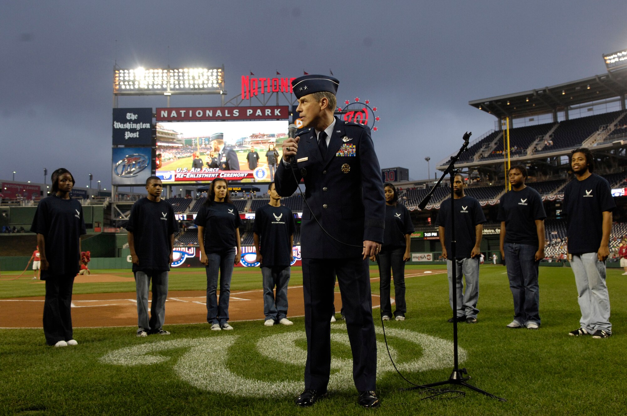 Maj. Gen. William Chambers, director of communication for the office of the secretary of the Air Force, introduces 10 Air Force recruits during the Washington Nationals Air Force Appreciation Night held Aug. 29 at Nationals Park in Washington, D.C. This was the first time the Washington Nationals Major League Baseball team held an event honoring the Air Force at the new park. (U.S. Air Force photo/Senior Airman Marleah Miller)