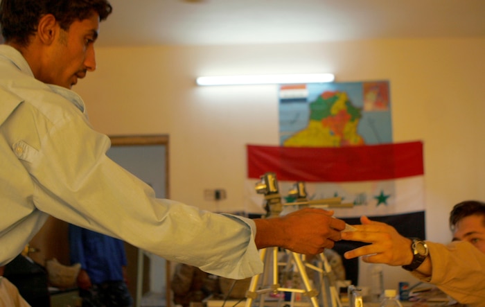 FALLUJAH, Iraq (Aug. 30, 2008) – A local Iraqi receives his new identification badge here, Aug. 30. Company I, 3rd Battalion, 6th Marines and Iraqi Police in the Shuhada District of Fallujah held the badge drive to serve more than 100 citizens with outdated identifications. Residents need a badge to enter the city and take advantage of employment opportunities. (Official U.S. Marine Corps photo by Cpl. Chris Lyttle) (RELEASED)