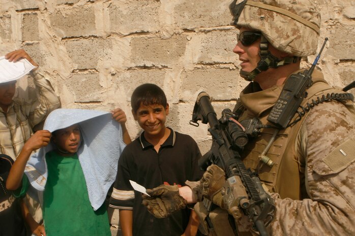 FALLUJAH, Iraq (Aug. 30, 2008) – 2nd Lt. Sean Leahy, platoon commander, 2nd Platoon, Company I, 3rd Battalion, 6th Marines, engages with local during a remote badging operation held here, Aug. 30. Marines and Iraqi Police worked together in the Shuhada District of south Fallujah and served more than 100 residents with updated identifications. (Official U.S. Marine Corps photo by Cpl. Chris Lyttle) (RELEASED)