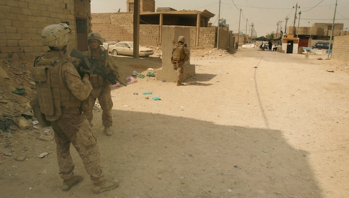 FALLUJAH, Iraq (Aug. 30, 2008) – Company I, 3rd Battalion, 6th Marines hold security in an alley way during a remote badging operation held here, Aug. 30. Marines and Iraqi Police worked together in the Shuhada District of south Fallujah and served more than 100 residents with updated identifications. (Official U.S. Marine Corps photo by Cpl. Chris Lyttle) (RELEASED)