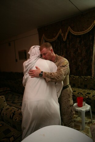 Captain Seth W. MacCutcheon, company commander, Company L, 3rd Battalion, 7th Marine Regiment, Regimental Combat Team 5, greets Sheik Khalif Awwad Farhan in Hit, Iraq, Sept. 2. Marines from 3rd Bn., 4th Marine Regiment, RCT-5 patrolled to the home of the sheik to introduce him to the Marines from 3rd Bn., 7th Marines, who will be relieving 3rd Bn., 4th Marines. The Marines discussed the current events in the area as well as accomplishments of the past six months. ::r::::n::