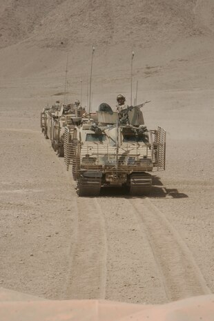 HELMAND PROVINCE, Afghanistan – U.S. Marine Gunnery Sgt. Clint W. Runyon, the Combat Camera chief assigned to Task Force 2d Battalion, 7th Marine Regiment, 1st Marine Division, Combined Joint Task Force Phoenix, and Creswell, Ore., native, captured this photo of British soldiers from The Queens Royal Lancers, Viking group racing to provide forward security for a convoy transporting a new turbine being moved 180 kilometers from Kandahar Airfield to the Kajaki Dam in the Helmand Province of Afghanistan, Aug. 30.  Gunnery Sgt. Runyon and Lance Cpl. Chad J. Pulliam, a COMCAM photographer and Sacramento, Calif., native, accompanied the convoy as it made its historic trek through the Helmand Province to document the entire movement of the turbine from Kandahar to the Kajaki Dam.  Photos of the journey were provided to news agencies in the United Kingdom.::r::::n:: “This is the first time that I know of that imagery has been provided from the field directly to news agencies,” Gunnery Sgt. Runyon said.  “Our photos were picked up by the British Broadcasting Corporation and Sky News.”  ::r::::n:: The operation was spearheaded by elements of the British Army’s 13th Air Assault Regiment and supported by U.S., Canadian, Danish and Afghan National Army forces.  During the operation, which was conducted between Aug. 27 and Sept. 5, British forces delivered the third turbine to the dam.  The turbines aid in providing hydro-electric power to Sangin, Musa Qaleh, Kandahar and Lashkar Gah, the provincial capital of Helmand.::r::::n:: The new turbine is capable of producing 18.5 megawatts of economically viable, renewable energy, which will be in addition to the dam’s current 16.5MW output.  ::r::::n::