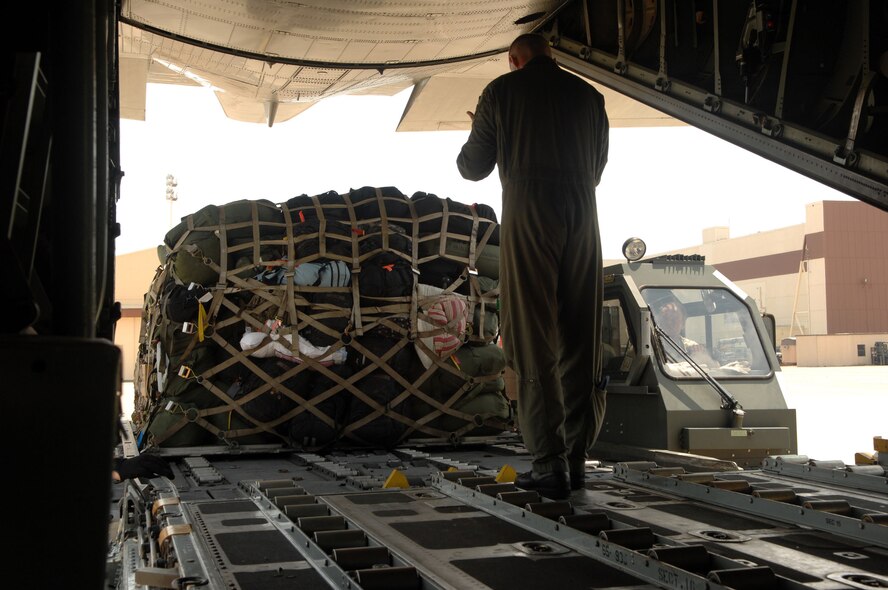 BARKSDSALE AIR FORCE BASE, La. -- Air Force Senior Airman Darrell Fenimore Jr., of the 2d Logistics Readiness Squadron, drives a k-loader to a Louisiana Air Guard C-130 and prepares to load a pallet onto the aircraft on the flightline here Aug. 30. Airmen from Barksdale responded to a request to support a short-notice deployment of the 1083rd Transportation Company from Minden. The 1083rd went to south Louisiana in anticipation of Hurricane Gustav making landfall there. (U.S. Air Force photo by Staff Sgt. Mike Andriacco) (Released)