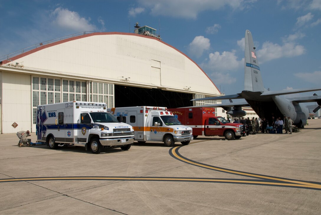 Local ambulances from the San Antonio area standby at Kelly USA, San Antonio,Texas for arriving patients evcuated by the 136th Airlift Wing,Texas Air National Guard and the 142nd Aeromedical Squadron from the Delaware Air National Guard, San Antonio,Texas, August 30, 2008.(USAF photo by MSgt Michael Lachman)