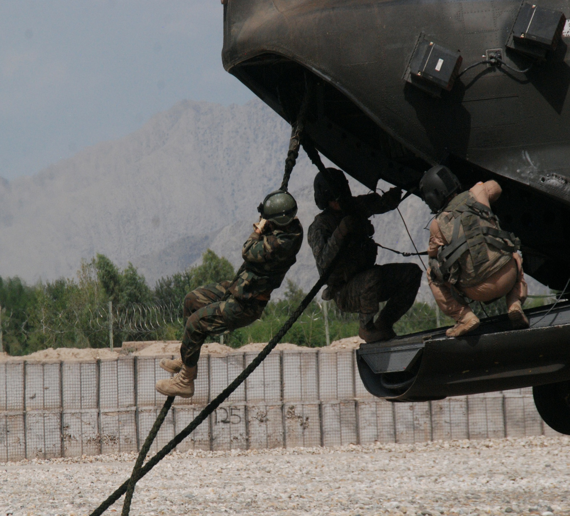 Afghan soldiers execute fast roping drills from the back of a CH-47 Chinook. The Afghans, along with American forces, conducted training using the Fast Rope Insertion Extraction System recently. (U.S. Army photo by Spc. George Welcome)