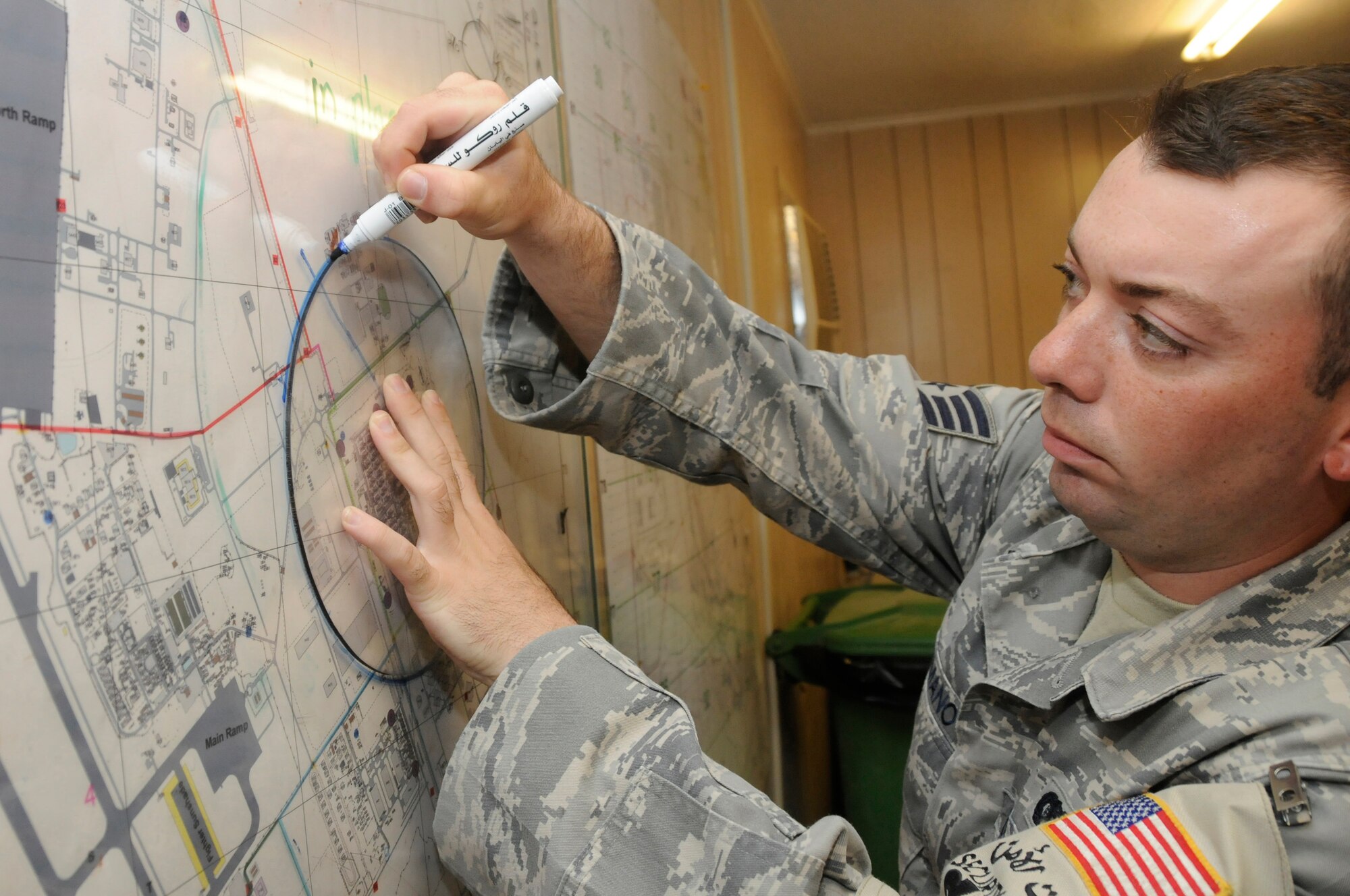 Staff Sgt. Thomas Romano, Base Defense Operations Center controller assigned to the 379th Expeditionary Security Forces Squadron, reviews evacuation procedures Aug. 30, 2008, at an undisclosed air base in Southwest Asia. The 379th ESFS is responsible for force protection of the base and all of its personnel and facilities. Sergeant Romano, a native of Boston, Mass., is deployed from Mildenhall Royal Air Force, United Kingdom, in support of Operations Iraqi Freedom, Enduring Freedom and Joint Task Force-Horn of Africa. (U.S. Air Force photo by Staff Sgt. Darnell T. Cannady)