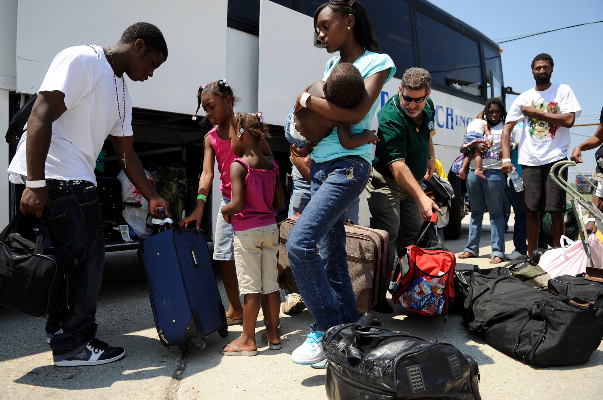 Evacuees leaving before Hurricane Gustav hits the Gulf Coast arrive at the Louis Armstrong International Airport in New Orleans Aug. 30.  They will be boarding flights that officials with the Federal Emergency Management Agency and Department of Defense have chartered to transport citizens who otherwise could not leave on their own to destinations safely outside the hurricane's path. (U.S. Air Force photo/Staff Sgt. Shawn Weismiller)