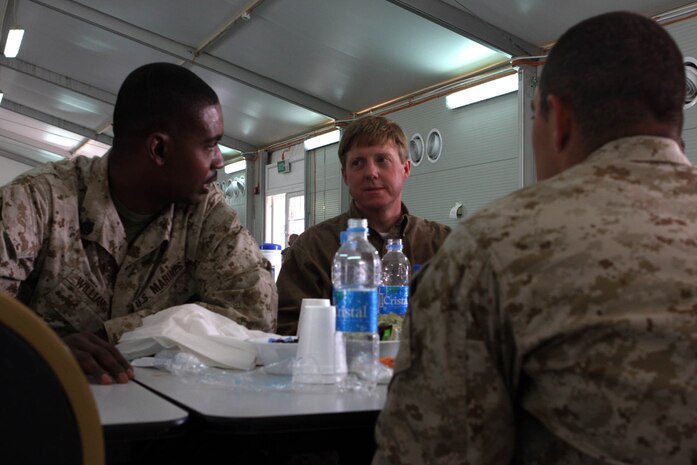 Don Cazayoux a Representative from Louisiana’s Sixth Congressional District, listens to Staff Sgt. Thaddeus J. Williams (left) and Cpl. Brandon W. Dion, during lunch with Marines selected from their home states. Both Marines are New Orleans natives assigned to Task Force 2d Battalion, 7th Marine Regiment, 1st Marine Division.  (U.S. Marine Corps photo by Cpl. James M. Mercure)