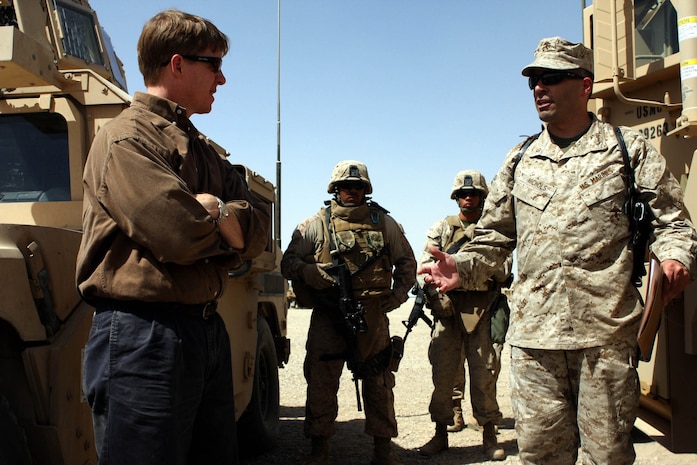 Don Cazayoux a Representative from Louisiana’s Sixth Congressional District, speaks to Maj. Rory A. Nichols, operations officer and Kenosha, Wisc., native, about the different types of equipment used by Task Force 2d Battalion, 7th Marine Regiment, 1st Marine Division. (U.S. Marine Corps photo by Cpl. James M. Mercure)