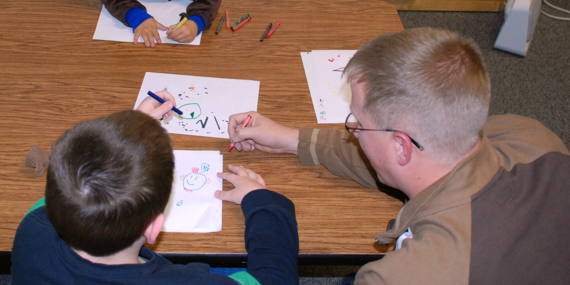 1st Lt. Jason Forquer, a staff social worker for the 82nd Medical Operations Squadron, plays with children at the Special Needs Parent Support Group Nov. 18. Lieutenant Forquer created the support group for parents to share information about available prgrams, vent about problems and relate to one another about raising a child with special needs. (U.S. Air Force photo/Airman 1st Class Candy Miller)