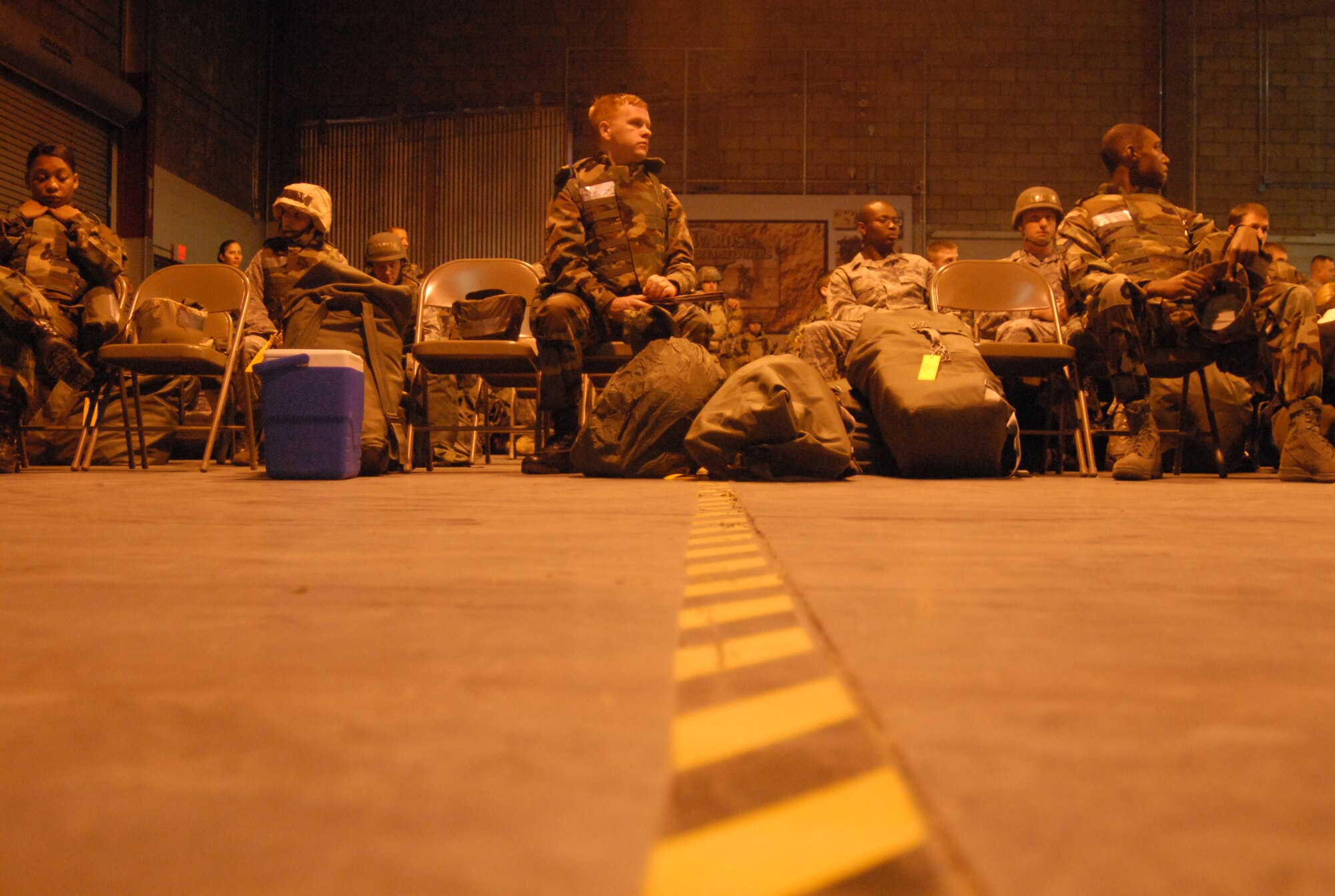 Edwards Airmen wait before a Targeted Readiness Inspection training begin Nov. 22 at the Mobility Processing Center. This is in preparation for the base's Unit Compliance Inspection in January. (Air Force photo by Senior Airman Julius Delos Reyes)