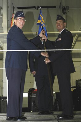 Col. James B. Hurley accepts the guidon and assumes command of the 911th Mission Support Group from Col. Gordon H. Elwell, Jr., 911th Airlift Wing commander during a change of command ceremony held here Oct. 4, 2008. 
