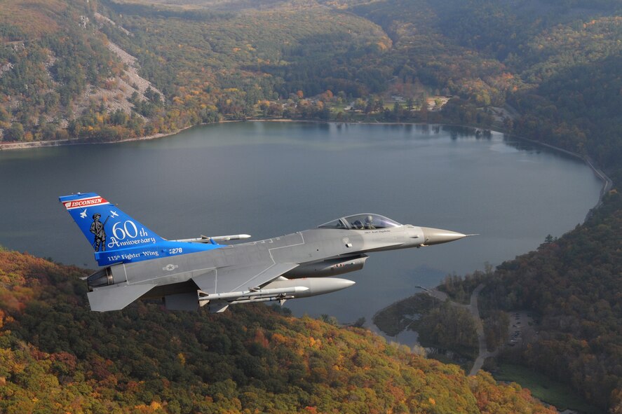 The unique tail flash on this F-16C Fighting Falcon from the 115th Fighter Wing, Wisconsin Air National Guard was created in celebration of the unit's 60th Anniversary.  The aircraft is shown over Devils Lake, Wisconsin October 18th, 2008.(U.S. Air Force Photo by Master Sgt. Paul Gorman) (RELEASED)