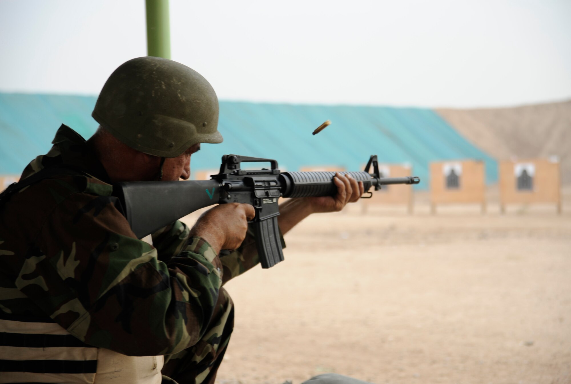 Iraqi army Sgt. Maj. Hannoon Saskbor Arian al Taai, Taji Location Command Sgt. Maj., fires his M-16 rifle at Taji Military Base, Iraq on Nov. 22. (U.S. Air Force photo/Staff Sgt. Paul Villanueva II)