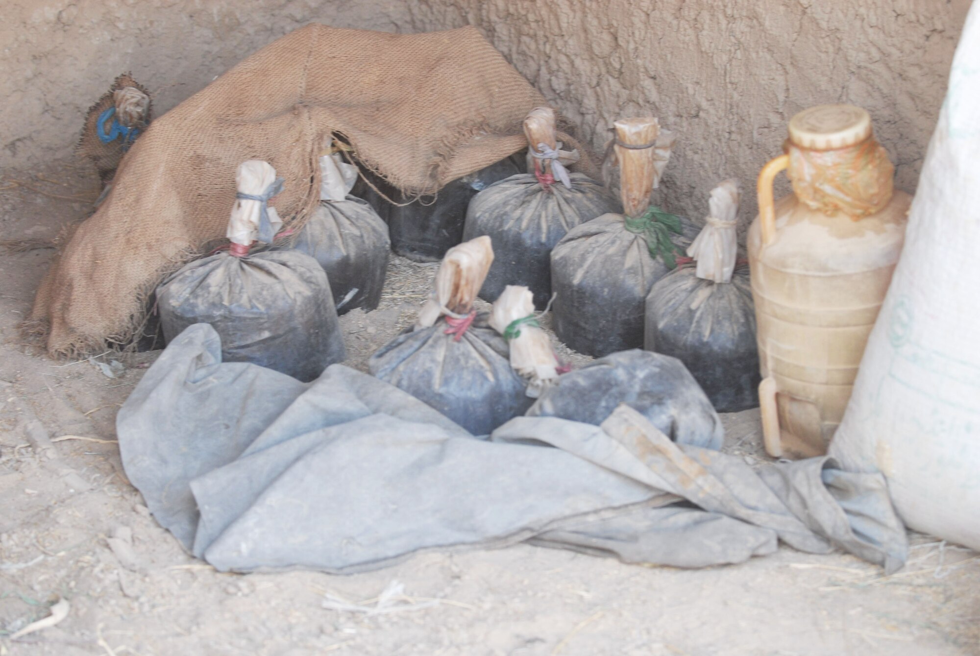 Southern Afghanistan -- Afghan Commandos from the 205th Kandak and Coalition forces Sunday discovered and destroyed more than 100 pounds of opium and more than 50 pounds of heroin during a search in Maywand District, Kandahar province, about 75 kilometers west of Kandahar city.  A search of the area also turned up bomb-making materials and weapons.
