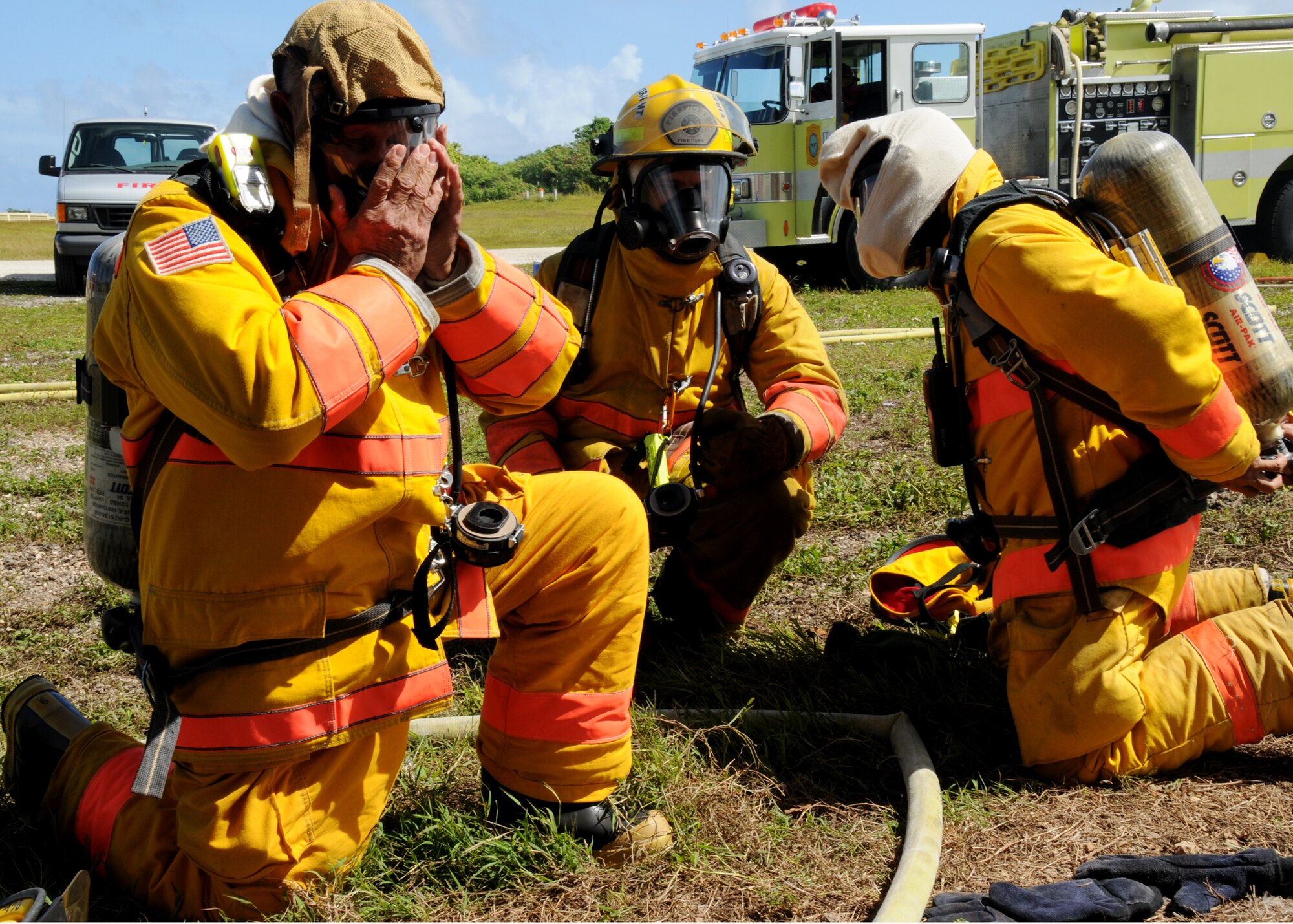 ANDERSEN AIR FORCE BASE, Guam - U.S. Navy firemen from Naval Base Guam suite up before entering a training scenario here Nov. 22. The Navy firemen used Andersen's live-fire training facilities to obtain Fireman 1 and Fireman 2 certifications. Andersen is home to Guam's only live-fire simulation training structures. (U.S. Air Force photo by Senior Airman Nichelle Griffiths)
