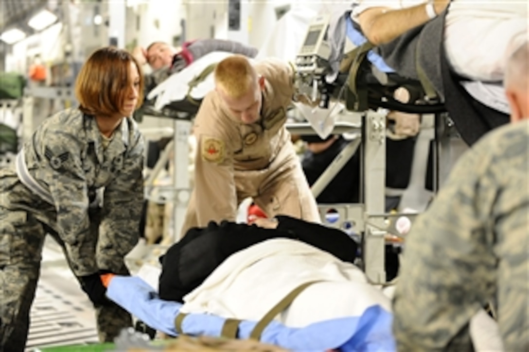 U.S. Air Force Senior Airman Samantha Brunner helps rack a patient onto a C-17 Globemaster III aircraft at Joint Base Balad, Iraq, on Nov. 27, 2008.  Brunner is an aerospace medical service journeyman with the 332nd Expeditionary Aerospace Medical Squadron and is deployed from the 911th Airlift Wing at Pittsburgh International Airport Air Reserve Station, Pa.  