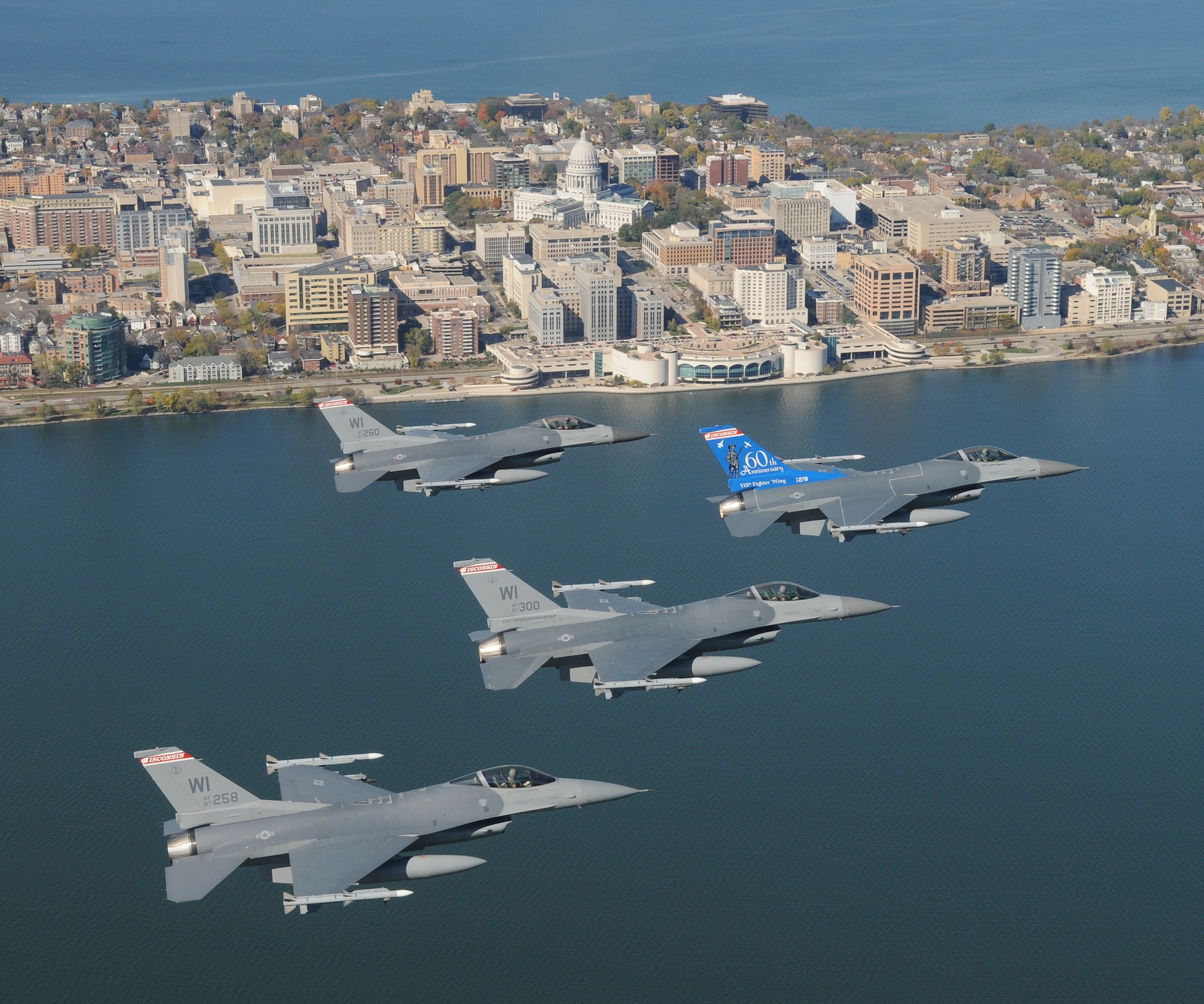 A four ship of F-16C Fighting Falcons from the 115th Fighter Wing, Wisconsin Air National Guard over Wisconsin's capital city of Madison October 18th, 2008.  In flight lead is aircraft 87-278 with a unique tail flash that was designed to celebrate the unit's 60th Anniversary.  (U.S. Air Force Photo by Master Sgt. Paul Gorman)  (RELEASED)