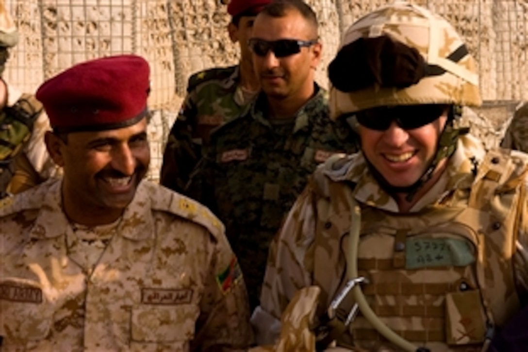 United Kingdom Maj. Gen. Andy Salmon, Order of the British Empire, Multinational Division South East Officer in Charge, prepares to board a helicopter after visiting the Al Qurnah district in Basra, Iraq, Nov. 24, 2008.