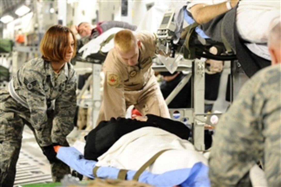 U.S. Air Force Senior Airman Samantha Brunner helps rack a patient onto a C-17 Globemaster III aircraft at Joint Base Balad, Iraq, on Nov. 27, 2008.  Brunner is an aerospace medical service journeyman with the 332nd Expeditionary Aerospace Medical Squadron and is deployed from the 911th Airlift Wing at Pittsburgh International Airport Air Reserve Station, Pa.  