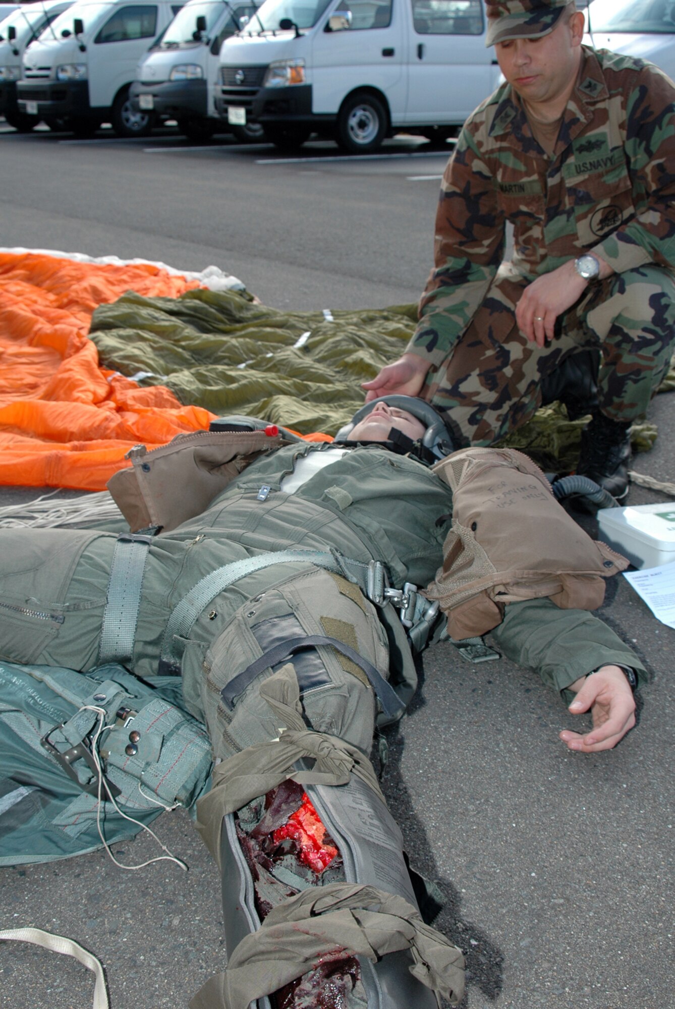MISAWA AIR BASE, Japan -- Petty Officer 1st Class Clifford Martin, Naval Air Facility Misawa, performs basic first aid on a simulated downed aviator, during an exercise Nov. 17, 2008, as part of a triennial Air Force Unit Compliance Inspection. Though Air Force units were the focus of the inspection team, personnel and assets from the Naval Air Facility played supporting roles. (U.S. Navy photo by Chief Petty Officer Brian Naranjo)