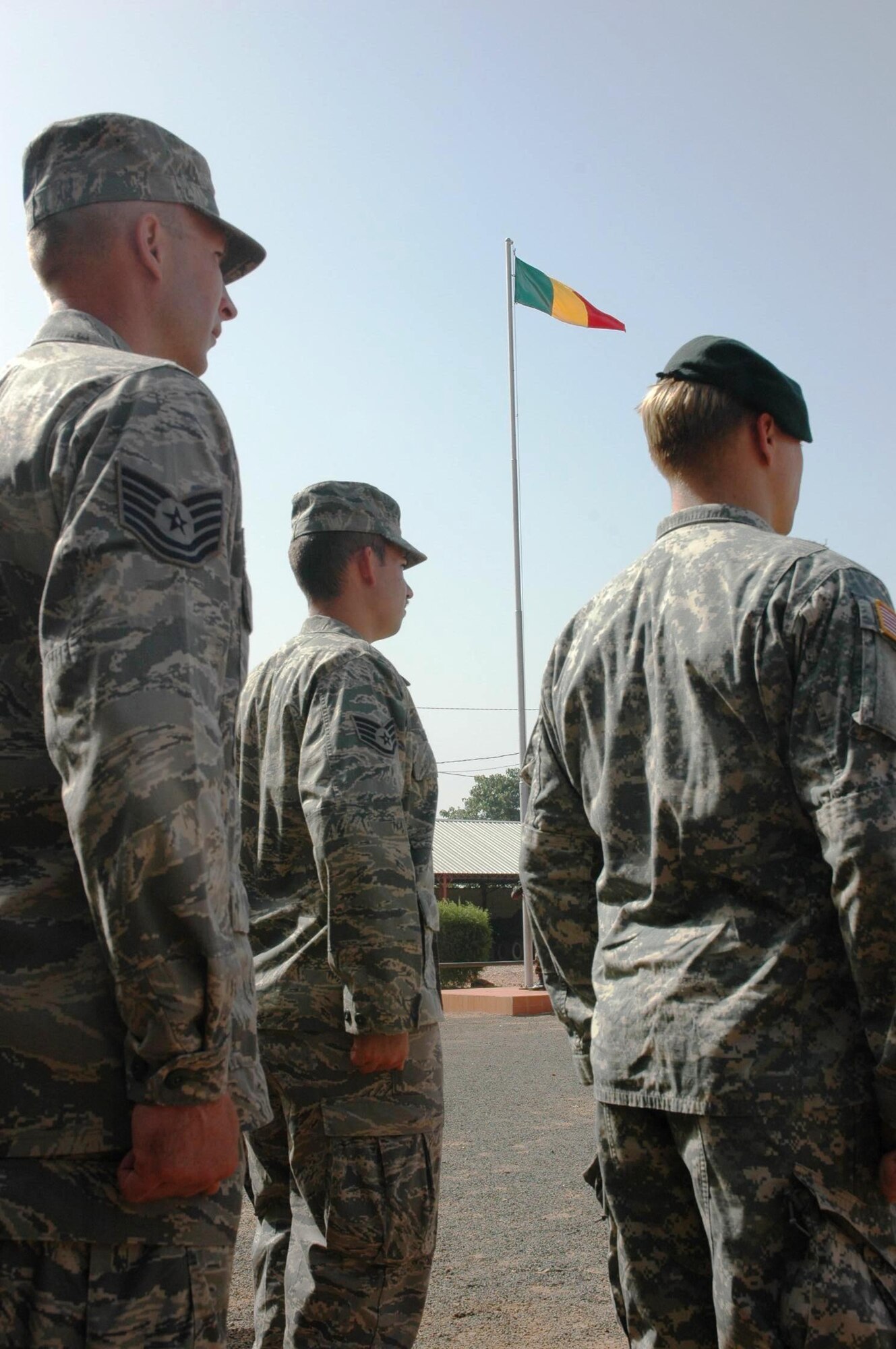 Tech. Sgt. Russel Lade and Staff Sgt. Eric Zunno, 1st Special Operations Helicopter Maintenance Squadron, stand in a three country formation of Malian, Senegalese and United States military members the opening ceremony for Exercise FLINTLOCK in Bamako, Mali Nov. 1. FLINTLOCK is a regularly scheduled exercise designed build capacity among Trans-Saharan nations so that they may more effectively address issues which threaten peace, stability and security. This year’s exercise included 15 African and Partner Nations and featured the CV-22, on its first operational deployment. (U.S. Air Force photo/1st Lt. Lauren Johnson)
