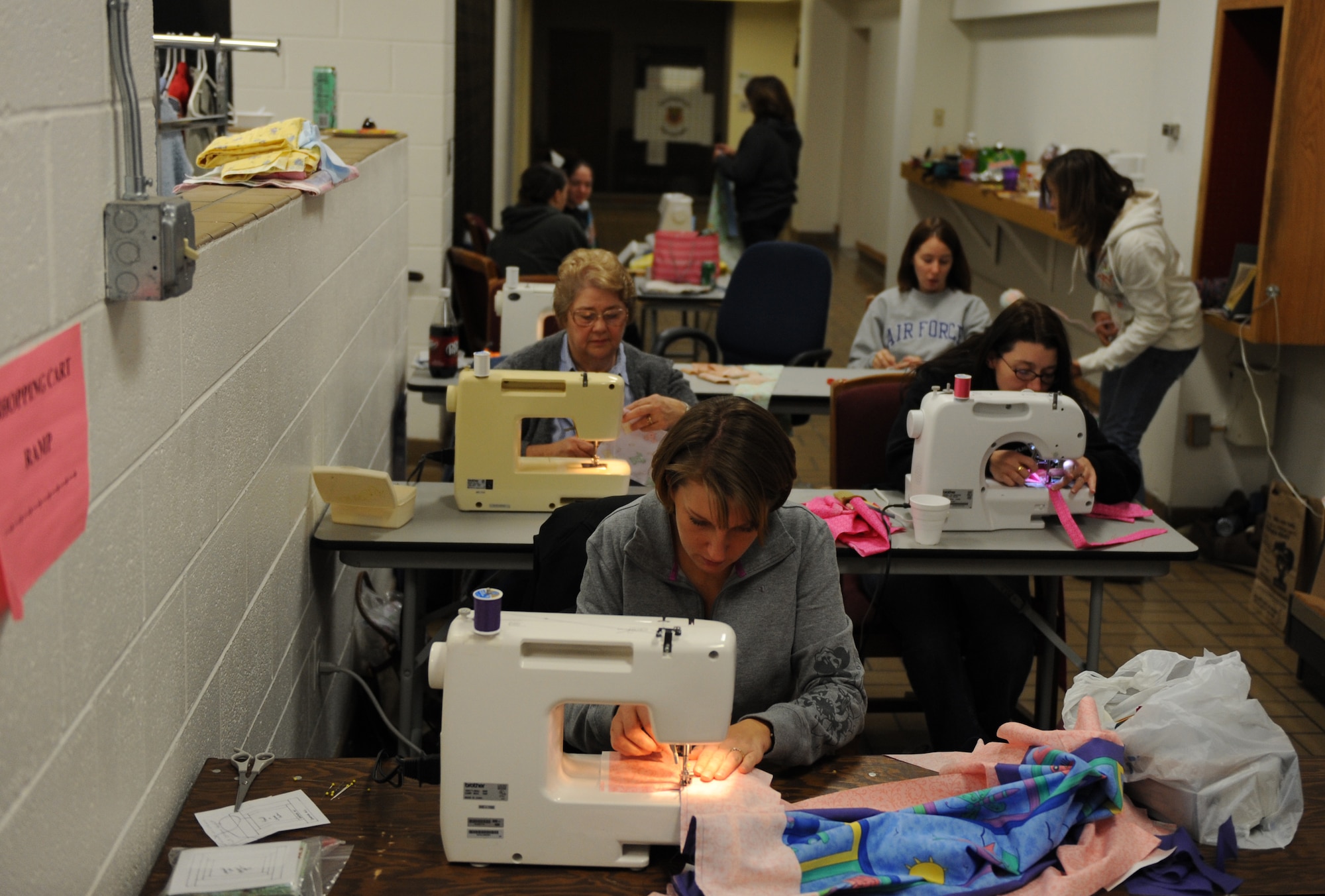 MOUNTAIN HOME AIR FORCE BASE, Idaho -- Volunteers assembled crocheted blankets, hats and cards into individual bundles at the Gunfighter Attic Nov. 22 to donate to families with newborn babies in appreciation of Hammond Quilt Day. Approximately 948 bundles have been delivered to newborns here since 2004. (U.S. Air Force photo/ Airman 1st class Renishia Richardson)