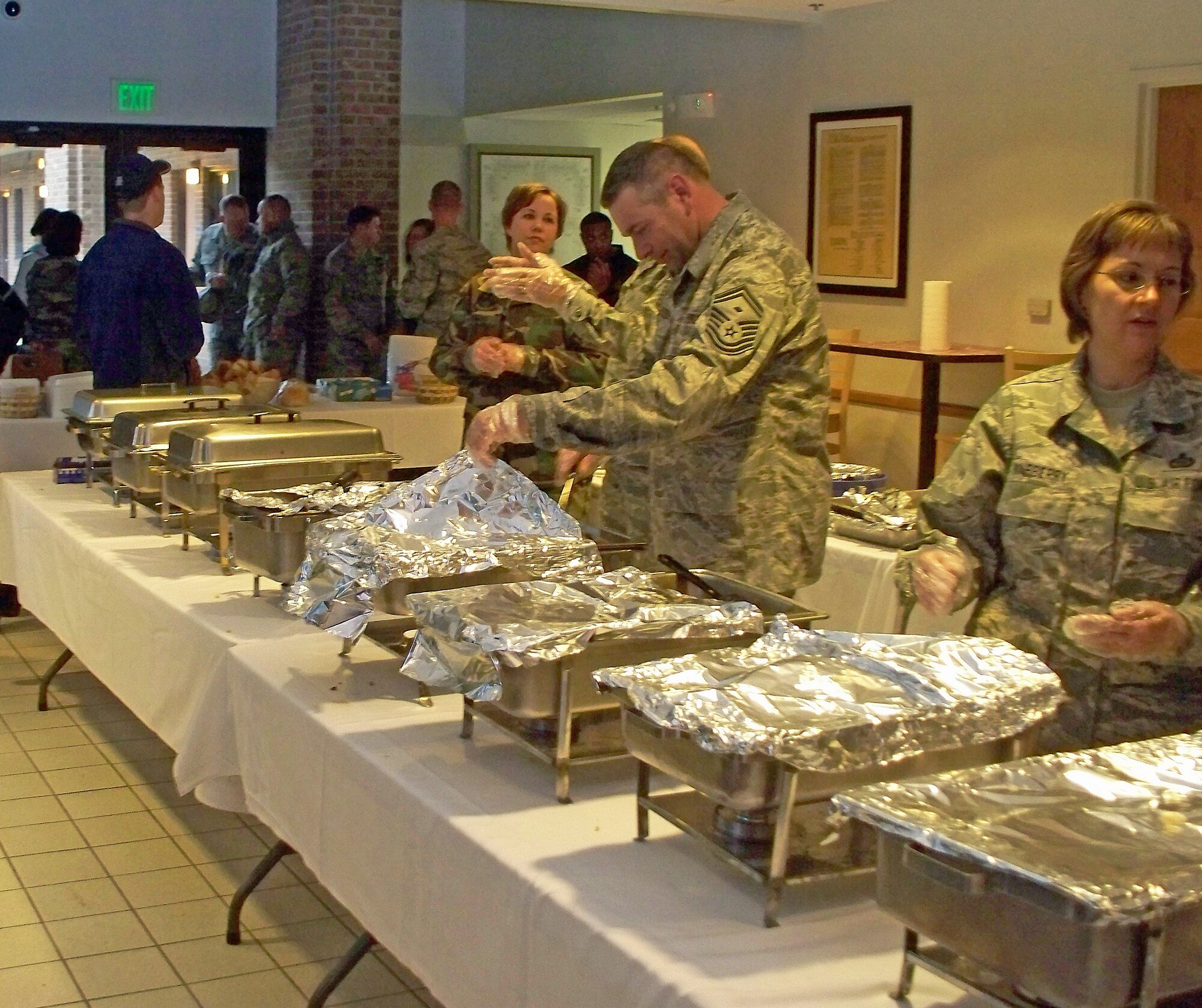 Airmen from Peterson and Schriever Air Force Base enjoy a Thanksgiving feast at Peterson AFB, Nov. 20. The annual dinner was free and hosted by the Peterson and Schriever First Sergeants. (Photos by Airman 1st Class Thomas Davis)
