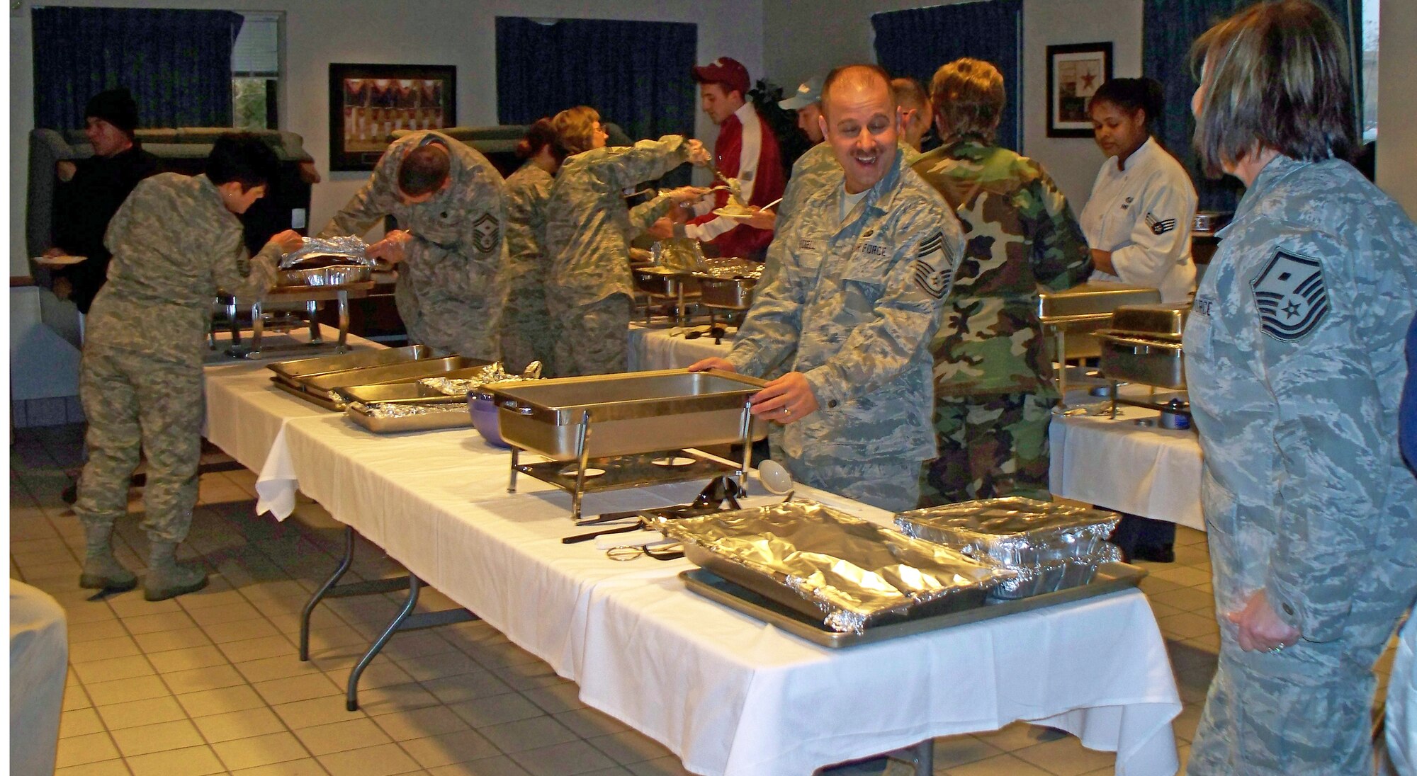 Airmen from Peterson and Schriever Air Force Base enjoy a Thanksgiving feast at Peterson AFB, Nov. 20. The annual dinner was free and hosted by the Peterson and Schriever First Sergeants. (Photos by Airman 1st Class Thomas Davis)
