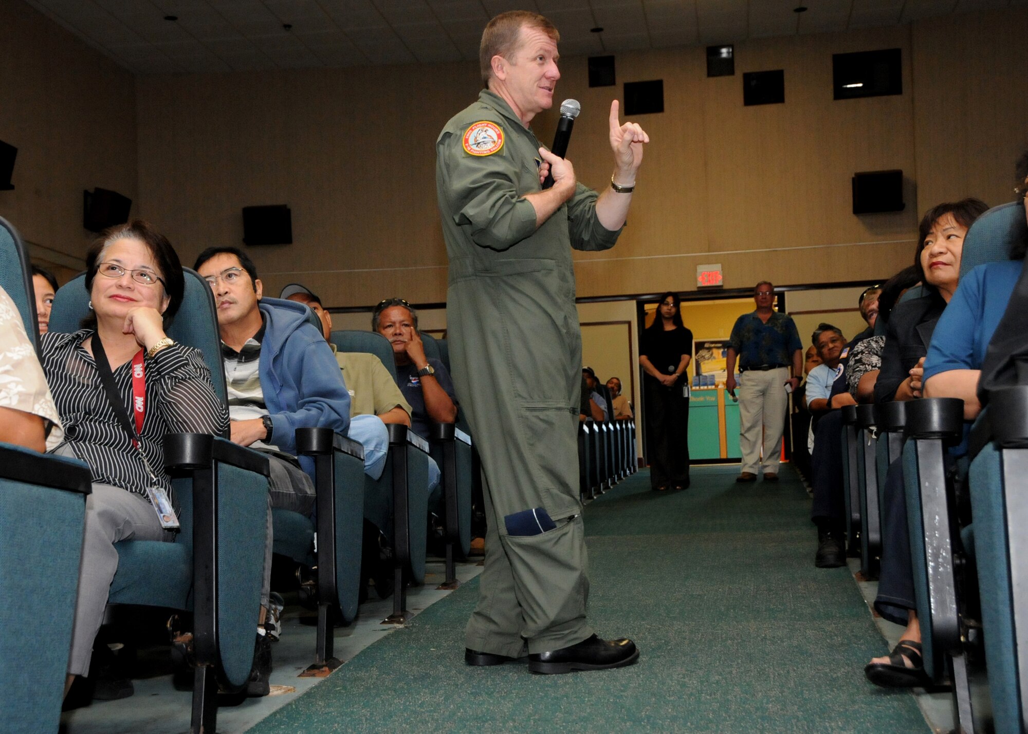 Brigadier Gen. Philip M. Ruhlman speaks to base civilians during a town hall meeting about joint basing and the future for these soon to be Navy employees Nov. 21 at Andersen Air Force Base, Guam. (U.S. Air Force photo/Senior Airman Nichelle Griffiths) 
