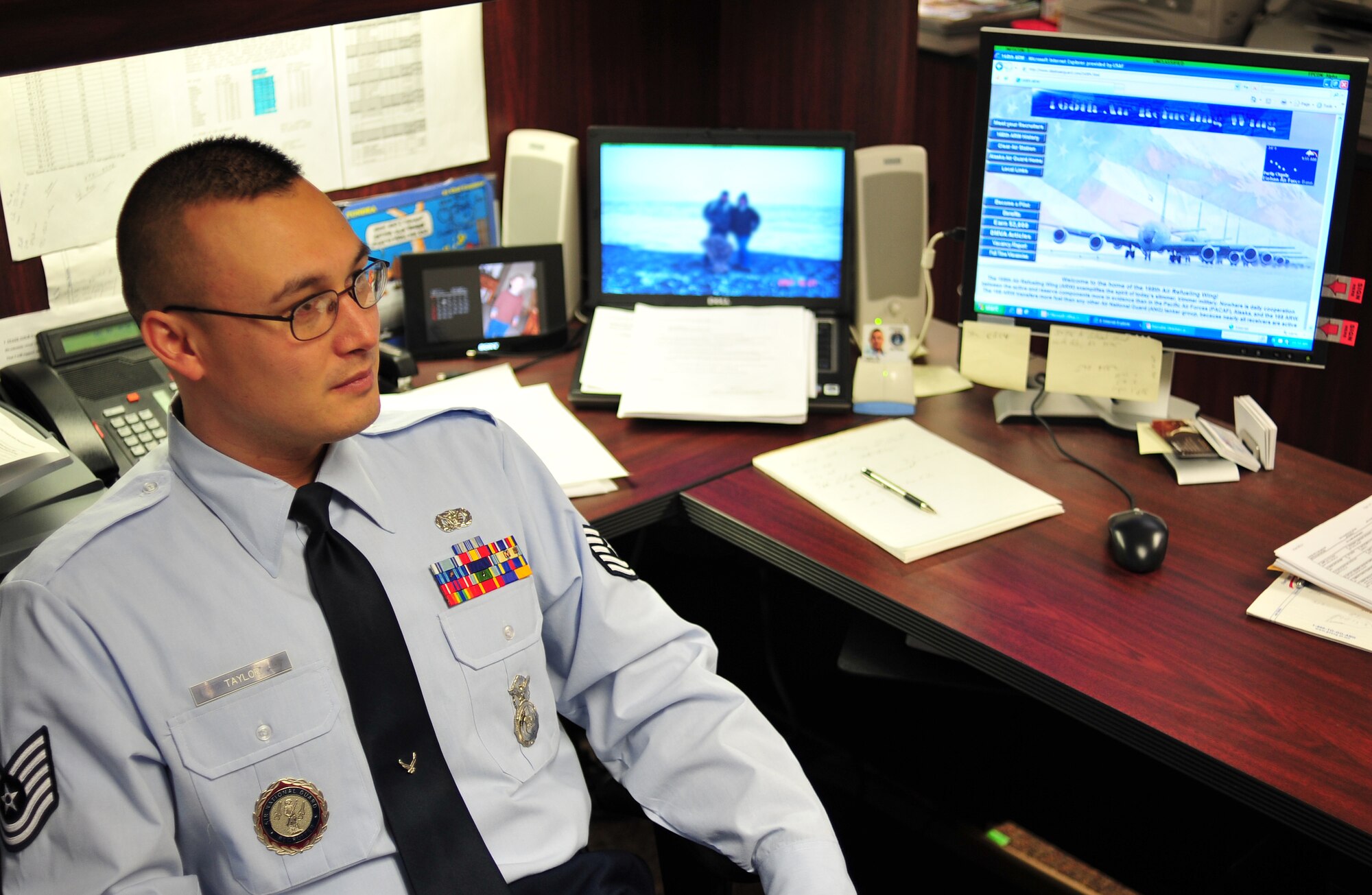 Tech. Sgt. Bill Taylor, 168th Air Refueling Wing, listens to an individual asking questions about the Alaska Air National Guard Dec. 2. Sergeant Taylor is a recruiter for the Alaska Air Guard on Eielson Air Force Base, and is the leading authority on the Palace Chase and Palace Front programs. The palace programs allow airmen to transfer from active duty to the Air National Guard and Air Force Reserve. (U.S. Air Force photo by Airman 1st Class Willard E. Grande II)