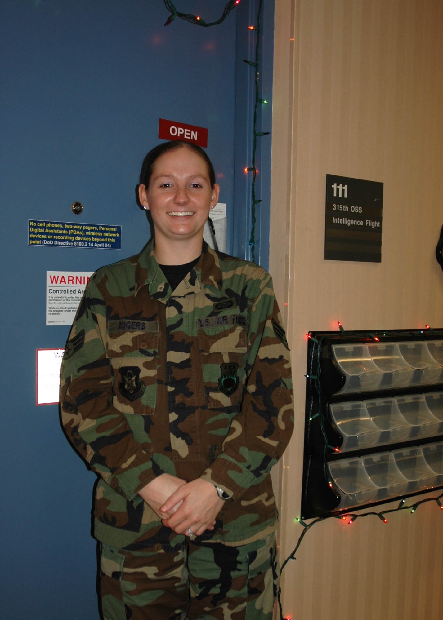 Senior Airman Shawna Roberts, 315th Operations Support Squadron, Intelligence Flight, shows off her Christmas spirit, December 2, 2008.  