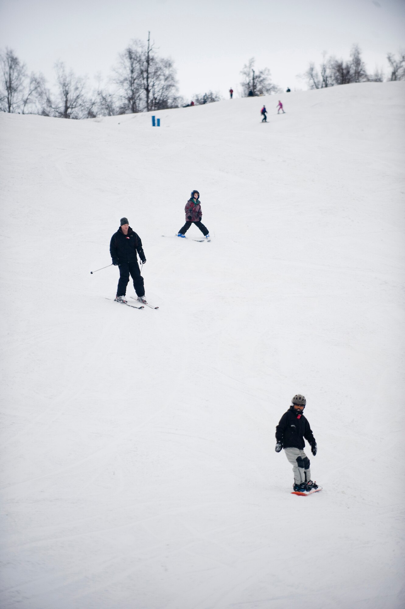 ELMENDORF AIR FORCE BASE, Alaska -- Ski and snowboarders ski downhill at Hillberg ski hill Nov. 28. This was the opening weekend for Hillberg. (U.S. Air Force photo/Senior Airman Jonathan Steffen)