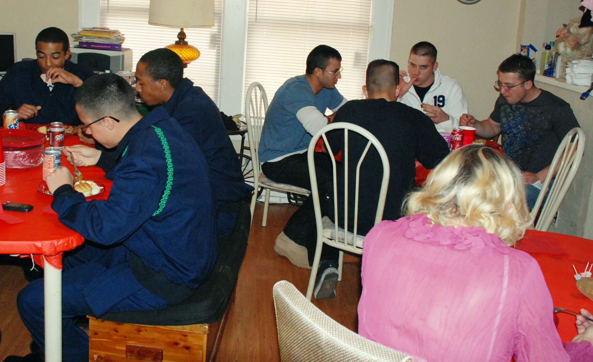 Airmen in Training enjoy a Thanksgiving meal in a home environment during Operation Thanksgiving Nov. 27. Operation Thanksgiving provided 536 Airmen in Training the opportunity to get to know the community outside of Sheppard. (U.S. Air Force photo/Airman 1st Class Candy Miller) 