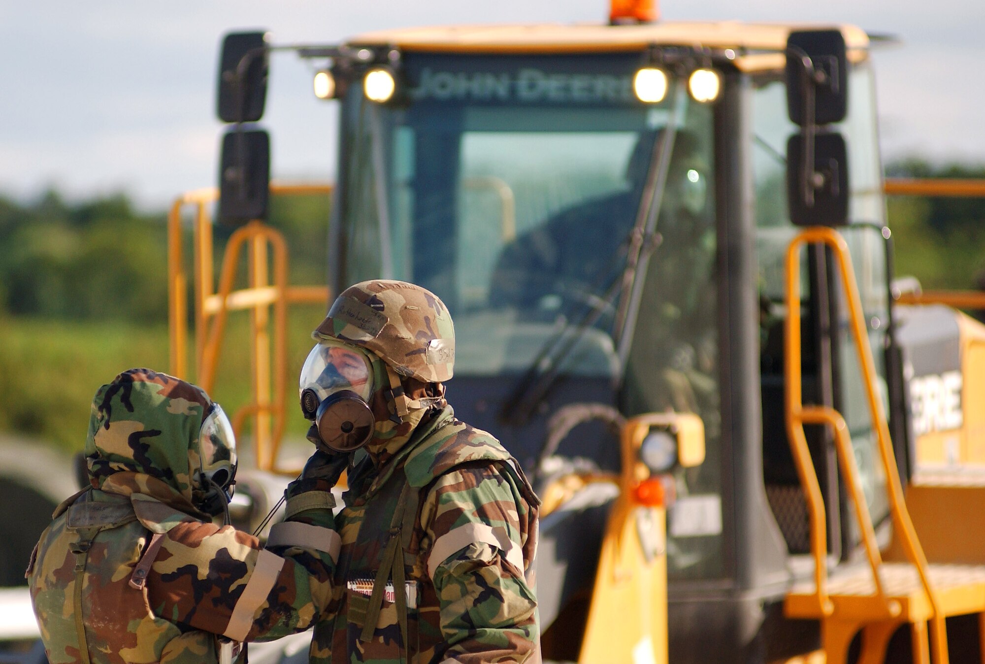 Airmen conduct buddy checks after donning their gas masks during Silver Flag Nov. 24 at Kadena Air Base, Japan. During the exercise, which is run by Det. 1, 554th RED HORSE Squadron members, Airmen trained to establish and sustain a forward operating base in simulated wartime conditions. (U.S. Air Force photo/Tech. Sgt. Rey Ramon) 
