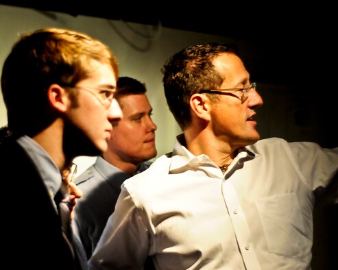 Richard Quest (right), CNN's international business and travel correspondent, explains the daily operations of CNN International to Scott Knuteson (left), a member of Air University Public Affairs. Several public affairs professionals from Air University and Air Command and Staff College made the trip to Atlanta on Nov. 19 to see the inner workings of CNN. (Air Force photo by Master Sgt. Scott Moorman)