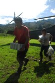 People from a remote village in Costa Rica carry back food and supplies delivered by Joint Task Force-Bravo Dec. 1. More than 150,000 pound had been delivered in Costa Rica and Panama by Nov. 30. (U.S. Air Force photo by Staff Sgt. Joel Mease)