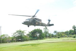 A Blackhawk helicopter from Joint Task Force-Bravo lands Dec. 1 at a food staging point near Puerta Limon, Costa Rica. Blackhawk crews would receive the cargo and then deliver the food to remote areas unaccessable by vehicle. (U.S. Air Force photo by Staff Sgt. Joel Mease)