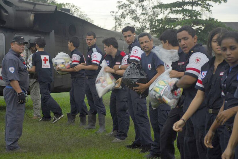 Members from the Costa Rica Red Cross load food and supplies onto a Blackhawk helicopter Nov. 30. Food and supplies were loaded onto the helicopters from staging points then delivered to remote villages in Costa Rica. (U.S. Air Force photo by Staff Sgt. Joel Mease)