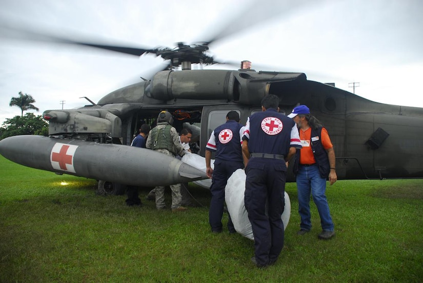 Members from the Costa Rica Red Cross load blankets onto a Blackhawk helicopter Nov. 30. Food and supplies were loaded onto the helicopters from staging points then delivered to remote villages in Costa Rica. (U.S. Air Force photo by Staff Sgt. Joel Mease)