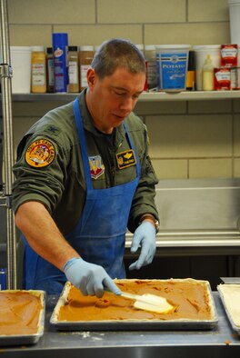 U.S. Air Force Col. Frank Stokes, 148FW Vice Commander, volunteers to help make 4000 pumpkin bars Nov. 25, 2008 for the 19th annual Thanksgiving Buffet held on Thanksgiving in Duluth, Minn.  The College of St. Scholastica sponsors a Thanksgiving Buffet for community members each year at the Duluth Entertainment and Convention Center.  (U.S. Air Force photo by TSgt. Jason Rolfe)