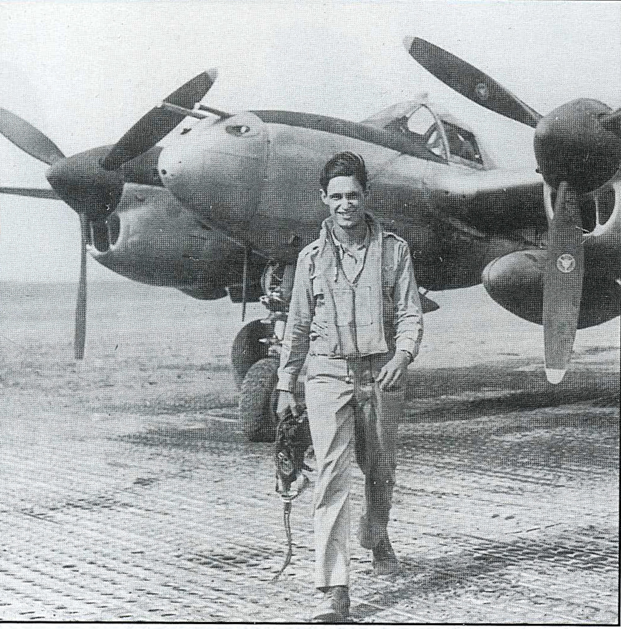 LANGLEY AIR FORCE BASE, Va. -- Capt. Tom Maloney, shown here at Foggia in May1944, walks away from his P-38 after a mission during World War II.  (Courtesy photo) 
