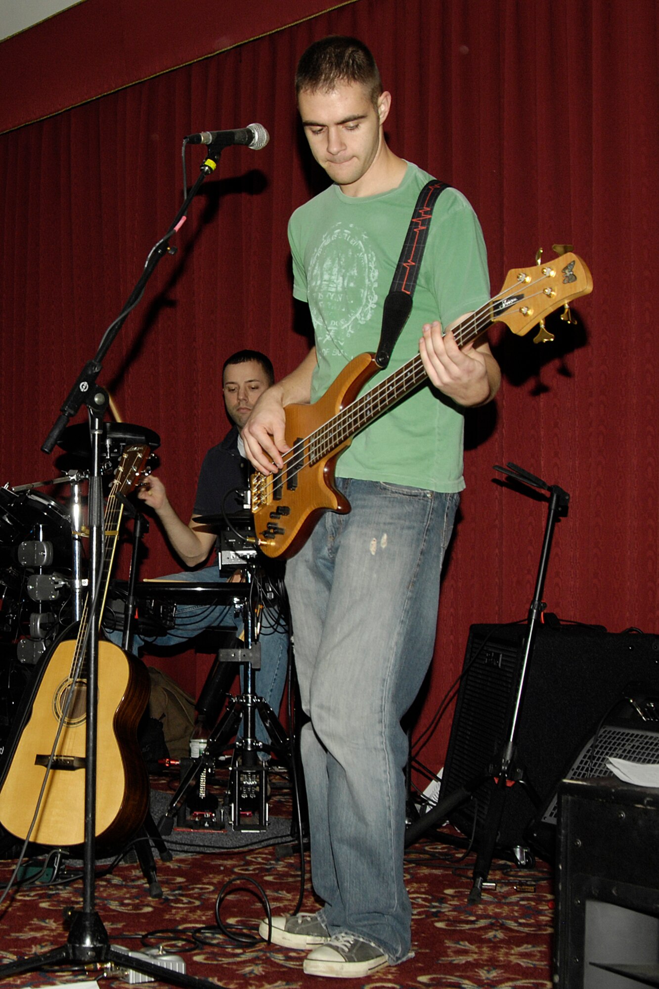 HANSCOM AIR FORCE BASE, Mass. – Senior Airman Tim Reeder performs on the bass guitar with Staff Sgt. Phil Pelletier on drums, during a recent Steak Night at the Minuteman Club. The Steak Night festivities included live entertainment from the band “Steak Fry” and line dancing. A portion of the proceeds raised during the evening went to help support Hanscom’s Combined Federal Campaign. Hanscom’s CFC raised more than $305,000.  (U.S. Air Force photo by Linda LaBonte Britt)