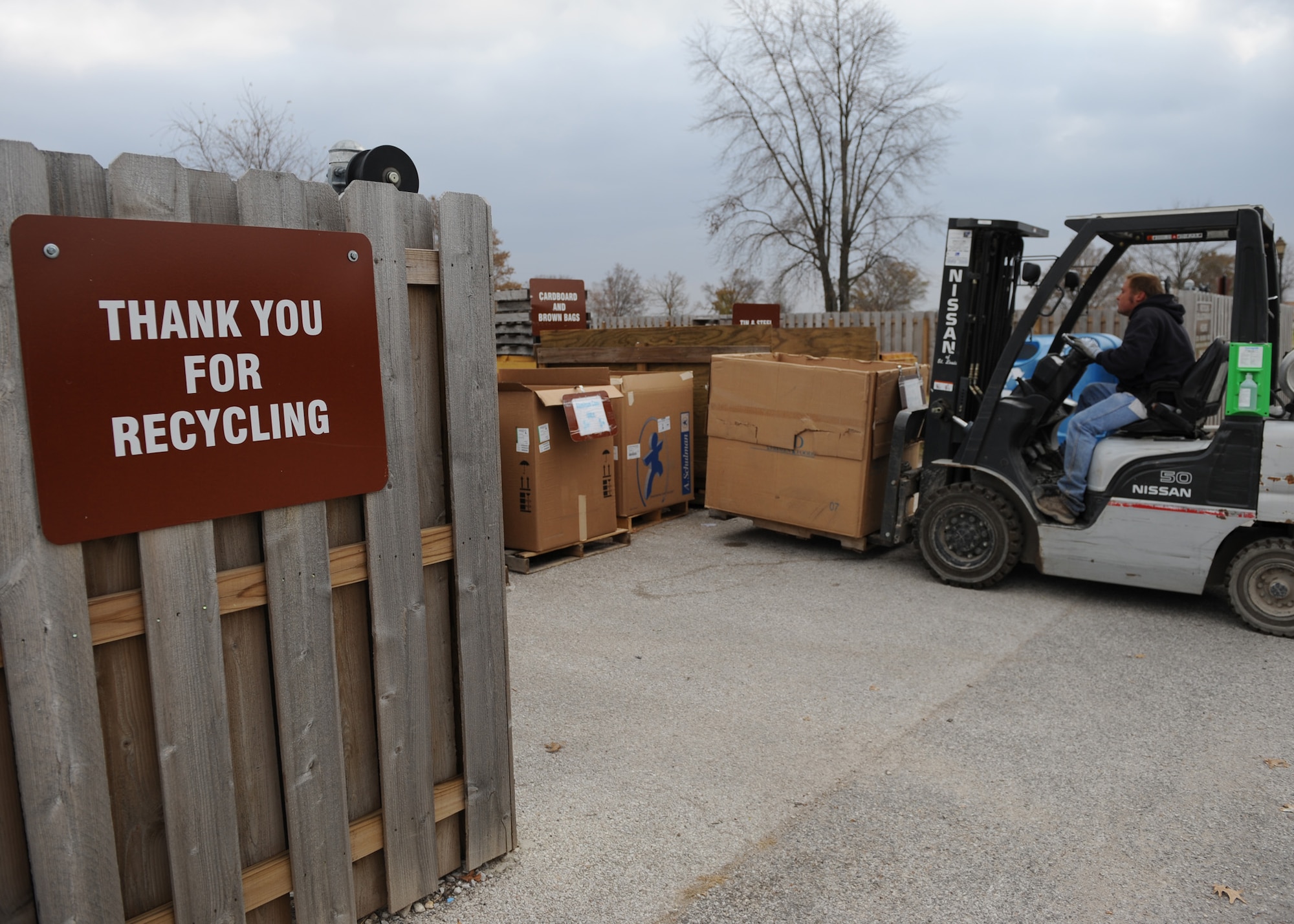 Craig Lappe, Scott Recycling Center Challenge Unlimited forklift operator, removes cans from the customer service area. The customer service area, open Monday through Friday from 7:30 a.m. to 4 p.m. for base personnel to drop off their recyclables.  (U.S. Air Force photo/Airman 1st Class Wesley Farnsworth)